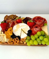 box of cheeses, fruits and sausages 