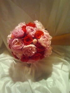 Bridal bouquet with pink peonies and red roses Bridal bouquet