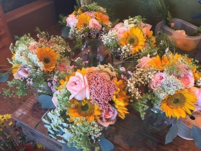 Bridesmaid's fun in the sun roses/sunflowers and wild filler flowers