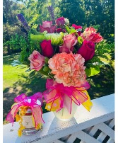 Bright Flowers with Candle  in Brenham, Texas | BRENHAM WILDFLOWERS FLORIST