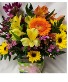 Bright Pick- Me -Up bouquet...rectangular vase With ribbon detail and seasonal bright flowers arranged