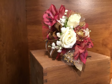 Burgundy and gold corsage