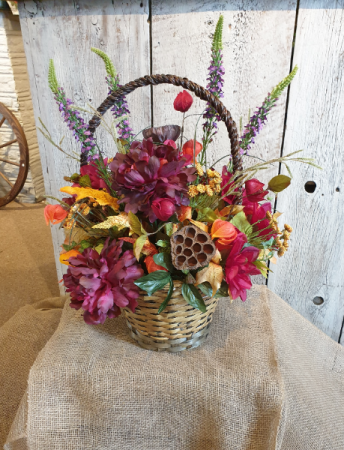 Burgundy Fall in a handled basket permanent floral