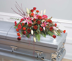 casket spray lilies and roses