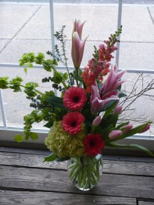 Celebrate! Designed Gerbera Daisies, Lilies, Bells of Ireland,Tulips and Snapdragons