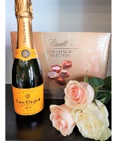 BRINGING IN THE NEW YEAR With Champagne, roses and chocolates