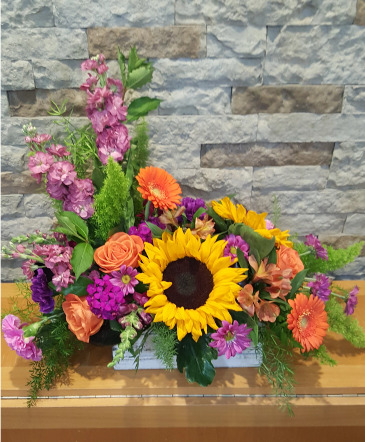 cheerful chatter centerpiece style low and wide in Louisville, OH | DOUGHERTY FLOWERS, INC.