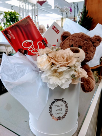 chocolates, cookies ,Bear and hand tied bouquet in keepsake hat box