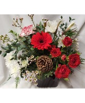 CHRISTMAS DELIGHT....Red and white flowers  With pinecones and holiday greens in a clear or red vase.