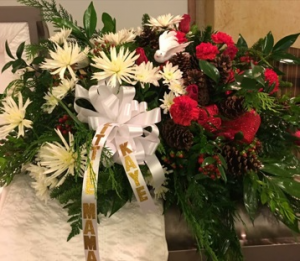 Christmas Casket Spray Christmas Green, White and Red Flower, accented with Pine Cones and Coffee Beans in Plainview, TX | Kan Del's Floral, Candles & Gifts Christmas Casket Spray Christmas Green, White and Red Flower, accented with Pine Cones and Coffee Beans in Plainview, TX | Kan Del's Floral, Candles & Gifts