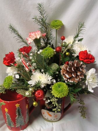 Christmas mug arrangement with red and white flowers!