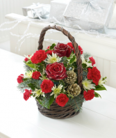 Christmas traditions  Basket of Christmas greens and flowers