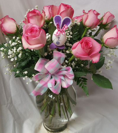 Dozen Pink Roses arranged in a Vase with a bow And bunny pic.