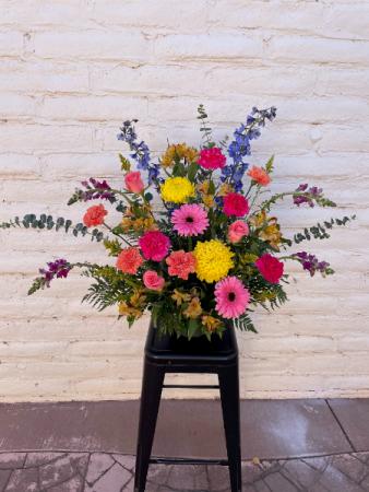 Colorful Container Spray Sympathy in Richfield, UT | Lily's Floral & Gift