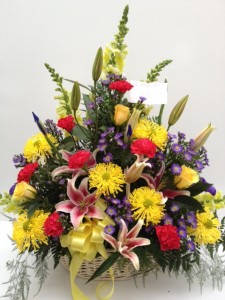Colorful Elegance Wicker Basket Funeral Flowers