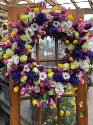 Colorful wreath from Roma Florist Sympathy arrangement from Roma Florist