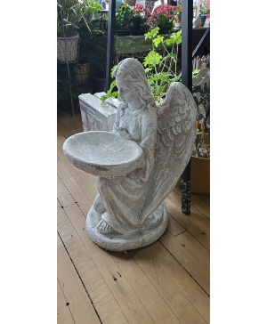 Concrete angel birdbath. 