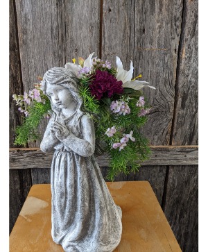 concrete angel with silk flowers 