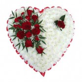 condolences from heart red roses and white pom pom saped heart standing spray