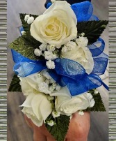 corsage with blue ribbon  