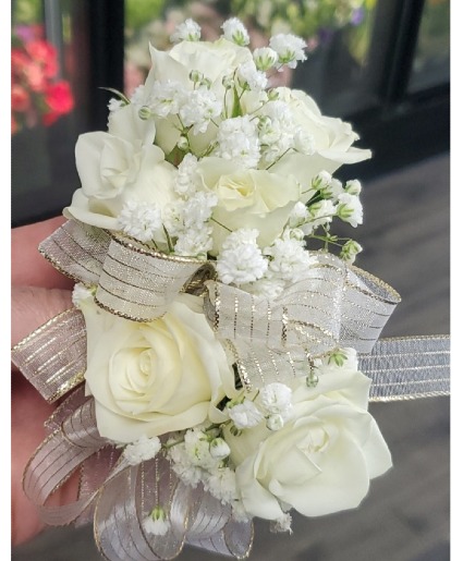 corsage with white ribbon