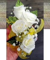 corsage with yellow ribbon  