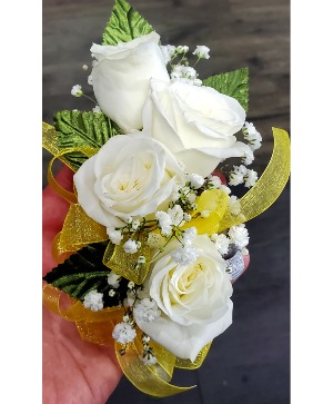 corsage with yellow ribbon  