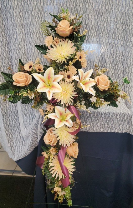 Cross w/ Silk Flowers and Purple Ribbon
