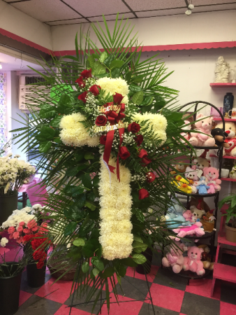 CROSS WITH ROSES FUNERAL ARRANGEMENT