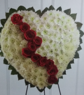 crossed shaped heart in white funeral flowers