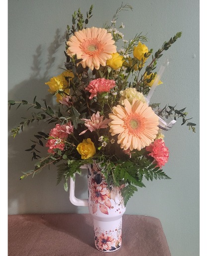 Cup of Flowers Drinking cup with flowers inside.