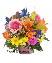 Custom designed by Floral Elegance  Fresh cut flowers