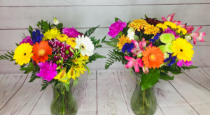 Splash of bright colour Hand tied assorted flowers in vase