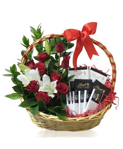 Two white lilies and chocolates basket 