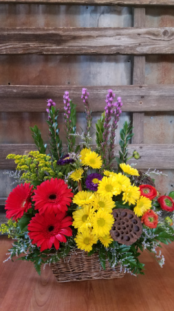 Daisy basket basket with gerbs, daisies, lotus pods, ranunculus and liatris