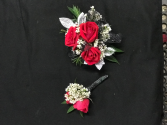 dark red boutonniere and corsage 