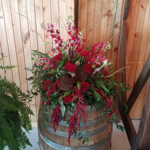 Deep Rich whiskey barrel arrangement Reception Florals