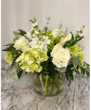 Deepest Condolences Moundy vase of white and green flowers