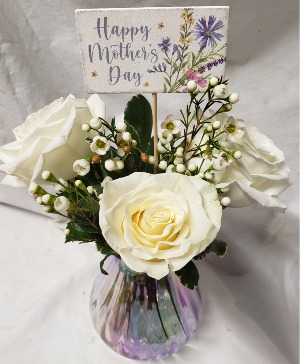 DELIGHTFULLY MOM...3 white roses in a iridescent  Vase with seasonal filler and price INCLUDES Mother's Day pick!