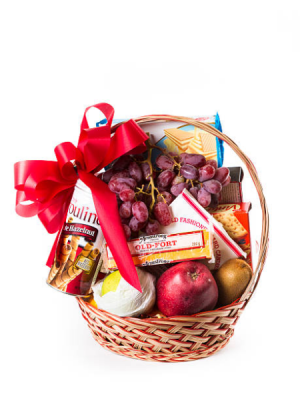 Deluxe Fruit Basket Fruit and candy basket in a wicker basket