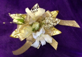 dendrobiums, spray roses and gold or silver leaf wrist corsage