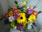 IN MEMORY ARRANGEMENT Take home arrangement after services. Mixed seasonal flowers in a basket.
