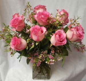 Dozen Beautiful Pink Roses arranged in a cube vase With seasonal filler...low arrangement all the way around !!! Loved by many!!