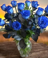 Dozen blue roses in a vase Vase arrangement