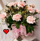 Dozen Pink Carnations arranged with Baby's Breath And Bow.