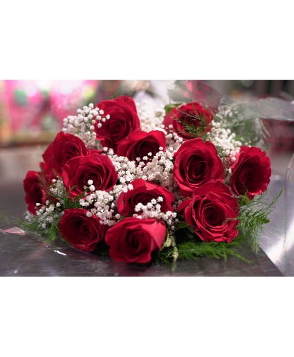 A Wrapped Dozen Red With Baby's Breath