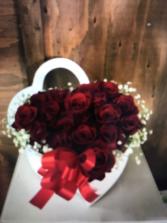 Dozen red roses in a heart shape box Valentines