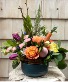 Easter  blooms in ceramic with grapevine  Table arrangement 