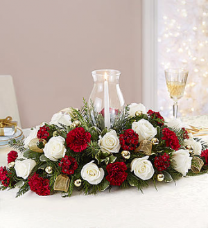 Elegant Christmas centerpiece with hurricane and candle in Lebanon, NH | LEBANON GARDEN OF EDEN FLORAL SHOP Elegant Christmas centerpiece with hurricane and candle in Lebanon, NH | LEBANON GARDEN OF EDEN FLORAL SHOP