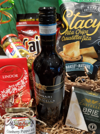 A CALL FOR CELEBRATION Basket with Wine and Decadent Treats